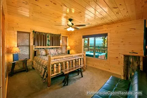 King suite in A View For All Seasons cabin near Gatlinburg with futon couch