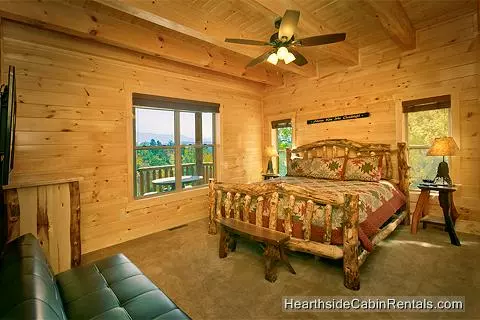 A View for All Seasons cabin near Gatlinburg king bed and futon couch