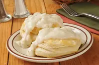 biscuits and gravy on table at restaurant