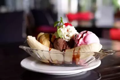 Banana Split Ice Cream on Wood Table