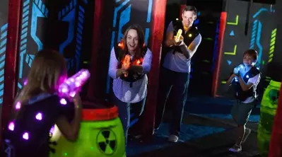 Family playing laser tag