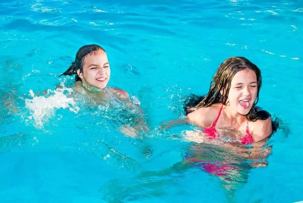 sisters-swimming-indoor-pool