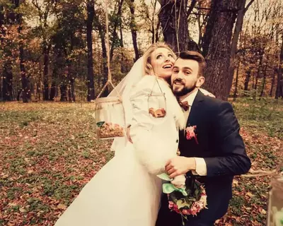 groom and bride outside Gatlinburg TN log cabins