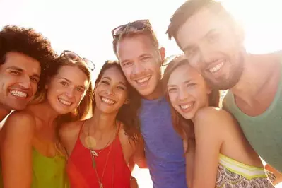 Happy group of friends outside of our large Pigeon Forge cabin rentals.