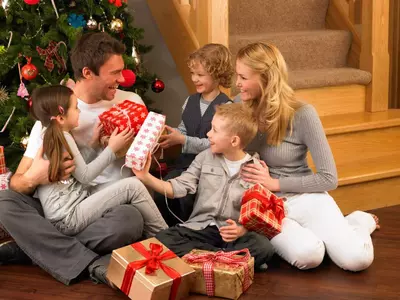 Family exchanging presents at Christmas