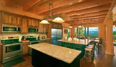 kitchen and dining room in a cabin in pigeon forge