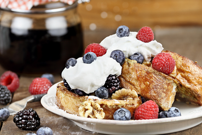 french toast with whipped cream and berries